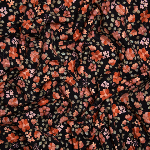 Jersey bawełniany GOTS pomarańczowe kwiaty na czerni