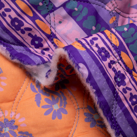 Tkanina pikowana dwustronna kwiaty pomarańcz i odcienie fioletu